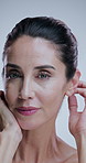 Studio, beauty and mature woman for anti aging cosmetics, skincare results and face transformation. Dermatology, salon and portrait of person for facial, wellness and texture on white background