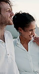 Beach, couple and walking with hug for travel, holiday adventure and memory for valentines day. Ocean, man and woman with love embrace for healthy relationship, bonding and vacation for anniversary