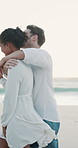 Beach, couple and love with hug for walking, holiday adventure and memory for valentines day. Ocean, man and woman with embrace for healthy relationship, bonding and travel vacation for anniversary
