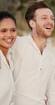 Walking, hug and happy couple at beach for honeymoon, valentines day and love in interracial relationship. Sea, vacation or people bonding on holiday for romantic anniversary, talking and travel date