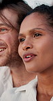 View, relax and happy couple at beach for honeymoon, valentines day and love in interracial relationship. Sea, vacation or people bonding on holiday for romantic anniversary, talking and travel date