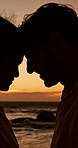 Head, sunset or couple at beach for valentines day, love or romance in committed relationship. Sea, night or people bonding on holiday vacation for romantic honeymoon, care and travel date together