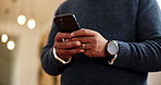 Man, hands and typing with phone at night for online booking, reservation or stay at luxury hotel. Closeup, male person or texting with mobile smartphone for accommodation app or hospitality at inn