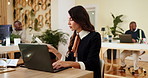 Business woman, laptop and reading with documents or information for data entry, checklist or process at agency. Female person, travel agent or employee with paperwork for schedule or booking trip