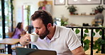 Coffee shop, remote work and businessman on laptop with drink, cappuccino and beverage in cafe. Restaurant, freelance consultant and person on computer for research, proposal and online project