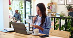 Business woman, laptop and thinking with documents at cafe for business analytics, performance or update. Female person, freelancer or analyst with computer or paperwork for statistics at coffee shop