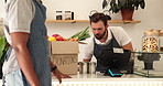 Cafe, cans and men with produce, donations and inventory for sustainable business aid. Teamwork, box and NGO with food distribution and volunteer project at community humanitarian coffee shop
