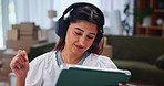Home, entrepreneur and woman with tablet, headphones and inventory for sales on online shop or boxes. Small business, music and person with tech for logistics, distribution and plan for digital store