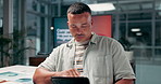 Man, tablet and typing at night, office and review, and program for employee health at startup. Person, digital touchscreen and application with overtime for feedback, project or report for wellness