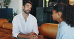 Serious, couple and talking in living room, home and support with advice for woman or relationship. House, man and discussion with partner in lounge, relax and commitment to marriage or conversation