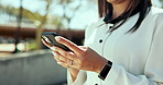 Business, outdoor and woman with smartphone, hands and connection with communication. Closeup, lawyer and attorney with cellphone, social media or message with digital app, contact and mobile user