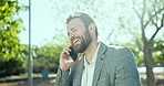 Happy, businessman and talking with phone call at park for conversation, laughing or funny joke in nature. Man, employee or humor with mobile smartphone for fun chat or friendly business discussion