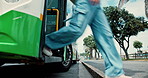 Legs, transport and people exit bus in road for morning commute, public service and destination stop. Shoes, feet and leaving at passenger terminal for urban travel, get off for work or end of trip