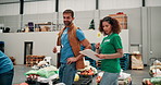 Volunteer, team and people in warehouse for stock donation, inventory discussion or grocery count. Charity, help or community service at storehouse for planning or food bank inspection with clipboard