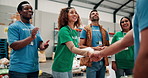 Smile, woman and volunteer with handshake for donation agreement, welcome and community service. People, talk and meeting on tablet with charity deal, humanitarian crises and ngo negotiation for help