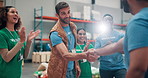 Happy, man and volunteer with handshake for donation agreement, welcome and community service. People, applause and sign up for charity achievement, humanitarian crises and ngo deal with negotiation