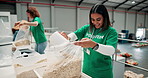 Happy woman, volunteer and donation with food package for charity or social responsibility at NGO warehouse. Female person, team or smile with oats, cereal or packing breakfast for community service