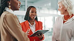 Collaboration, diversity and tablet with business women in lobby of office for meeting or planning. Conversation, project management and update with employee team in workplace for design feedback