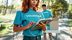 Outdoor, woman and volunteering with tablet for charity, NGO and website for community service. Park, people and nonprofit manager with tech for outreach project, scroll and program for food donation