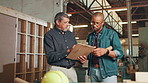 Men, carpenter and clipboard with talk at factory for design, insight or advice for project for yacht building. People, leader and checklist for steps, mentor or manufacturing with wood at workshop