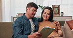 Pregnant, home and couple on sofa with tablet for online shopping, prenatal app and parenting blog. Family, pregnancy and man and woman on digital tech together for love, talking and relax on couch