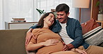 Support, pregnancy and happy couple on sofa with hands on stomach for love, care and conversation at home together. Maternity, future or people in living room with growth, hug and child development