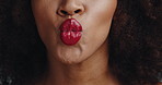 Mouth, lipstick and kiss in studio with makeup, sign and symbol with love, care and cosmetics. Person, red lips and pout with gloss for beauty with emoji, transformation and color with change