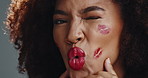 Kiss, makeup and red lipstick with face of woman for glow, self care and cosmetic lip marks. Shine, beauty salon and glamour with African person for aesthetic, wink and cosmetology treatment
