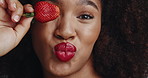 Strawberry, makeup and red lipstick with face of woman for glow, self care and vegan cosmetics. Shine, natural beauty and glamour with African person for aesthetic, mouth and cosmetology treatment