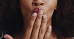 Hands, blow kiss and cosmetics in studio with smile, lips and symbol for love with self care. Person, model and happy with emoji, mouth and kindness with lipstick, makeup and beauty with icon
