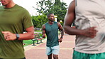Athlete, talking and friends with running outdoor for morning routine, marathon support or wellness performance. Fitness energy, people and runner club with cardio pace, endurance workout or training