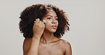 Studio, woman and brush for makeup, beauty and foundation for skin with cosmetics, routine and luxury. White background, glow and application of powder with tools, makeover and person with product
