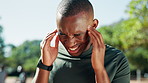 Man, headache and frustrated with exercise in park, stress and massage for relief with training in summer. African person, burnout and migraine with worry, pain and touch temple for workout in Kenya