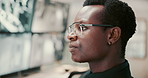 Black man, security guard or screen with surveillance for building safety in control room. Male person, CCTV operator or mall cop with display system for protection, monitoring footage or observation