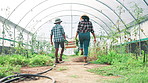 Mother, child and groceries crate on farm, carrying produce and teamwork with organic agriculture. Family, ecology basket and together for vegetable business, supply chain and growth at greenhouse