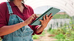 Farming, hands and research with tablet in greenhouse, harvesting and typing for plants information. Closeup, person and farmer with technology for agriculture, sustainable growth and digital tips