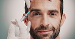 Hands, face and beautician with man with injection in studio for skincare, antiaging and collagen. Cosmetic, needle and plastic surgeon with person for transformation with filler by gray background.