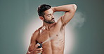 Deodorant, hygiene and man with underarm spray for odor control, grooming or morning routine. Antiperspirant, portrait or happy person with cosmetics product for sweat protection on studio background