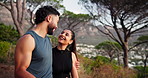 Fitness, mountain and couple hug rest for exercise, marathon training and workout together in nature. Sports, runner and happy man and woman talking for wellness, performance and health in morning