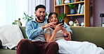 App, phone and relax with couple on sofa in living room of home together for communication. Browsing, conversation or hugging with happy man and woman in apartment for online shopping or planning