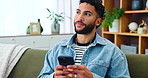 Sofa, happy man and thinking with mobile for chat, text message or comment for reel on social media. Home, male person and ideas with phone for application, meme website or communication with contact