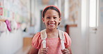 Education, happy and face of girl at school for learning, knowledge and future. Child development program, studying and growth with kid in hallway of Stem academy for students, classroom and youth