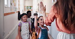 Happy, teacher and students with high five at school for morning motivation, education support and enter classroom. Learning academy, educator and greeting children at doorway for welcome or teaching