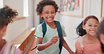 Education, energy and running with kids at school for recess, growth and learning. Friends, knowledge and child development with group of students in hallway of academy for scholarship and classroom
