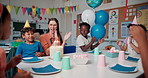 Children, clapping and cake for birthday party at school with teacher, friends and students. Kids, food and happy people applause at celebration, congratulations and special event with class together