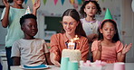 Children, clapping and cake for birthday party with teacher serving friends or students at school. Kids, food and happy people at celebration with candles, congratulations and applause in classroom