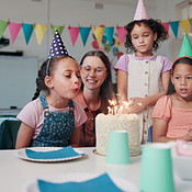 Birthday cake, candles and teacher with children in classroom for ...