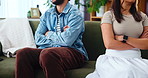 Frustrated couple, hands and ignore with fight on sofa for argument, disagreement or conflict at home. Closeup, separation or toxic relationship with emotion for breakup, divorce or dispute at house