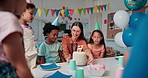 Kids, party cake and birthday in school with friends, teacher and students in classroom. Children, candles and happy people with food at celebration, social gathering and special event together