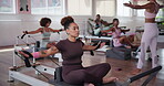 Workout, reformer and fitness with woman in class for pilates, health and balance machine. Exercise, wellness and core strength with people in yoga studio for resistance self care and flexibility